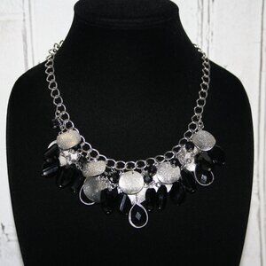 Beautiful silver and black charm necklace by Charming Charlie 18-21"